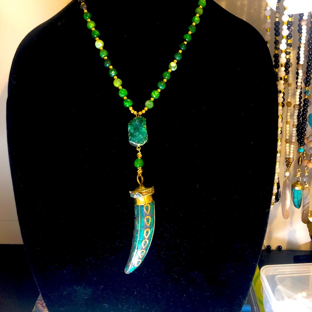 Tibetan jade horn with jade bead necklace.